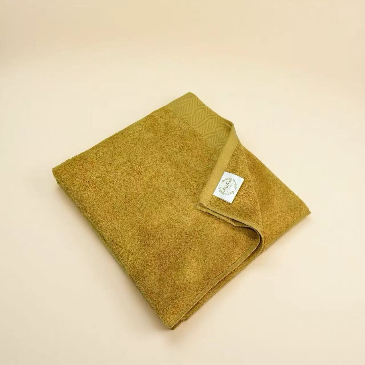 Serviette de bain jaune gingembre